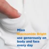 Rich cream texture of Mixa Niacinamide Bright for dry and sensitive skin