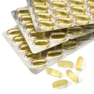Mivolis Omega 3 softgel capsules close up texture fish oil capsules